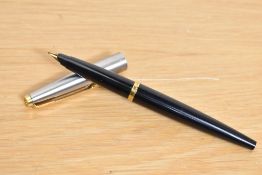 A Parker 45 cartridge fill fountain pen in black having a lutraloy cap with gold trim