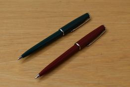 Two Parker 45 ballpoint pens one in green the other burgundy