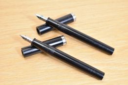 Two Sheaffer No Nonsense cartridge fill fountain pens in black one having Sheaffer Italic M Made