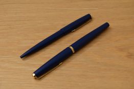 A Parker 45 cartridge fill fountain and ballpoint pen set in matte blue