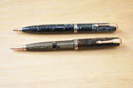 Two Parker Vacumatic propelling pencils in green and brown