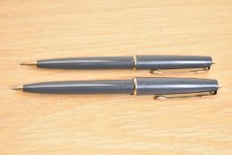 A Parker 45 ballpoint pen and propelling pencil in grey