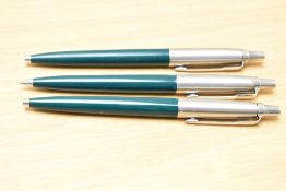 Three Parker Jotter ballpoint pens in dark green