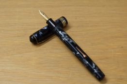 A Conway Stewart 55 lever fill fountain pen in blue black marble with one broad and two narrow cap