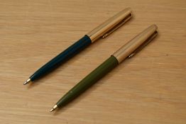 Two Parker 45 ballpoint pens in sage and dark green with gold filled caps
