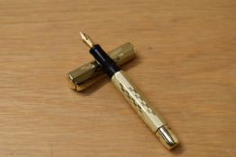 A Record Cavaliere (Milan) button fill fountain pen in Rolled gold of octagonal form having a Record