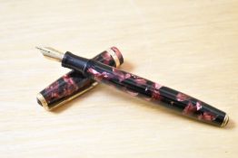 A Parker Duofold button fill fountain pen in red and black marble with broad Duofold cap band having