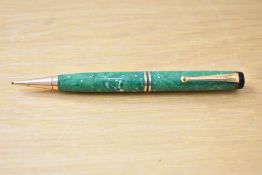 A Parker Duofold flat top propelling pencil in green