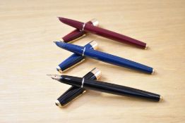 Three Parker 17 Super Duofold aerometric fill fountain pen in blue, black and red with gold trim