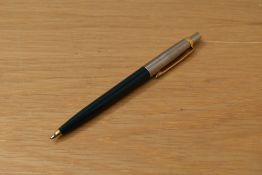 A Parker 45 ballpoint pen dark green with flighter cap having gold trim caps