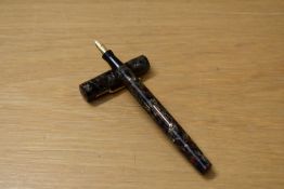 A Mabie Todd & Co Blackbird BB2 39 lever fill fountain pen in Marbled Red (mottled) having 14ct nib