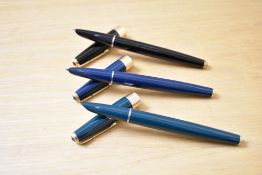 Three Parker 17 Super Duofold aerometric fill fountain pen in blue, black and green with gold trim