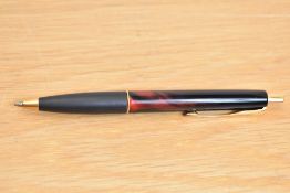 A Parker Frontier ballpoint pen in two tone red and black with gold trim