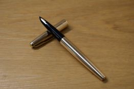 A Parker 61 Insignia converter fill fountain pen in gold plate