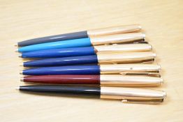 Seven Parker 51 ballpoint pens in black, turquoise, two dark blue, teal, grey and brown all with