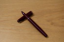 A boxed Parker 17 Lady aerofill fountain pen in burgundy with gold trim. Chalk marks present