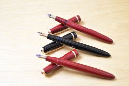 Three Parker Slimfold aerometric fill fountain pens two in red one black with Slimfold cap band