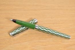 A Parker 45 Harlequin converter fill fountain pen in the rare green shield pattern