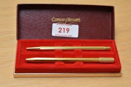 A boxed gilt Conway Stewart propelling pencil and ballpoint pen of octaginal form