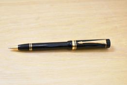 A Parker Centennial ballpoint pen in black.