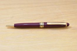 A L'Plume ballpoint pens in burgundy with gold trim.