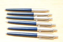 Six Parker Jotter ballpoint pens in blue