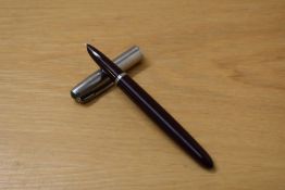 A boxed Parker 51 aeromatic fill fountain pen in burgundy with lustraloy cap. Crack to barrel