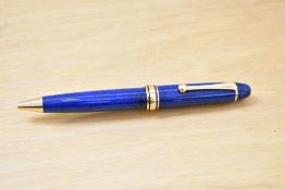 A L'Plume ballpoint pens in blue with gold trim.