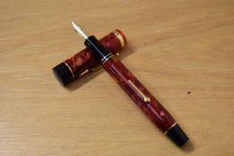 A Presentation boxed Conway Stewart Churchill lever fill fountain pen in cherry red with