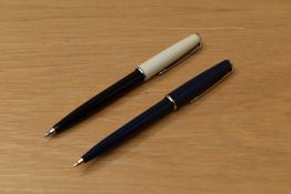 Two Parker 45 CT (aka The Arrow) ballpoint pens one black with white cap the other dark blue