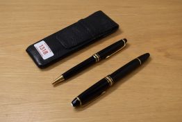 A Montblanc Meisterstuck 146 piston fill fountain pen and ballpoint pen in black with gold trim