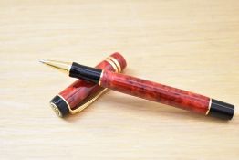 A Parker Centennial MKII rollerball pen in red jasper with two cap band.
