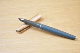 A Parker Custom Insignia converter fill fountain pen in grey with rolled gold cap