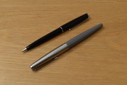 A Parker 45 fibre tip pen in grey and Esso advertising propelling pencil in black