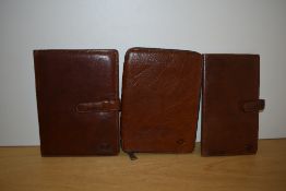 A boxed 'the Bridge' leather card wallet 23.5x14, a leather writing case 23.5x18cm, and a zipped