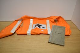 A British Railway high-vis vest sold together with a signal test book, dated 1964-68.