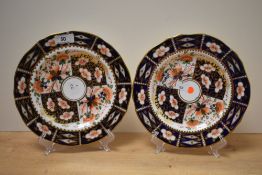 Two 19th Century Royal Crown Derby cabinet plates, of scalloped outline and decorated in the