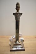 A Victorian silver plated table lamp base, of Corinthian column form and raised on a moulded and