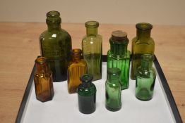 A selection of coloured glass apothecary bottles, the largest measures 10cm high