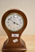 An Edwardian balloon shaped mantel clock by Butt & Co. Ltd. of Chester, the inlaid mahogany case