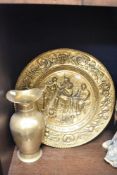 A brass plaque depicting a pub scene sold alongside a large jug/wine vessel.