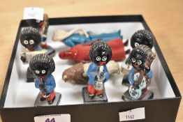 Six hand painted pottery Robertson jam jar musician figurines, the largest measures 7cm high, and
