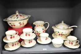 A selection of St. Michael Damson patterned tableware, featuring damson fruit against a cream