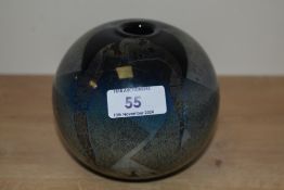 A John Ditchfielf iridescent art glass vase, of spherical form and decorated in an abstract