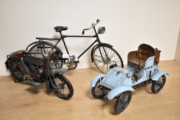 A vintage collectable cast metal study of a bicycle, measuring 39cm long, together with
