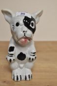An early 20th Century hollow cast and glazed pottery study of Bonzo the Dog, measuring 19cm high