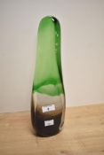 A 20th Century free form art glass sculpture, tinted in green and measuring 34cm tall