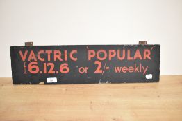 A vintage wooden sign for Vactric Popular, measuring 14cm x 56cm