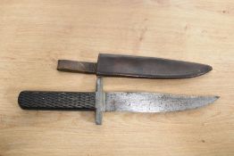 An early 20th Century military dagger with brown leather sheath, the blade marked for 'Superior