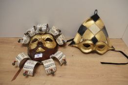 Two modern Venetian papier mache carnvival masks, the largest measures 29cm high